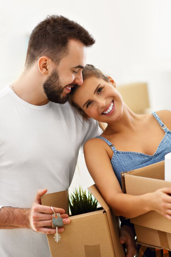 image of a young couple smilng and embracing