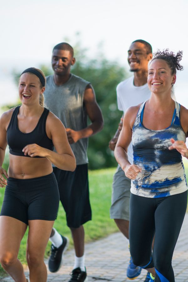 image of a group of people talking and jogging together