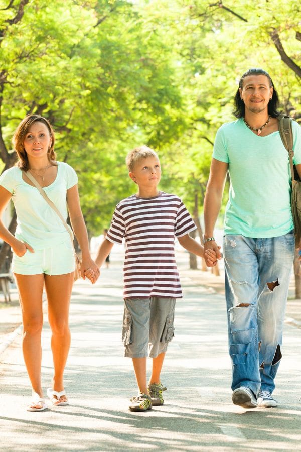 image of a family walking through a park together