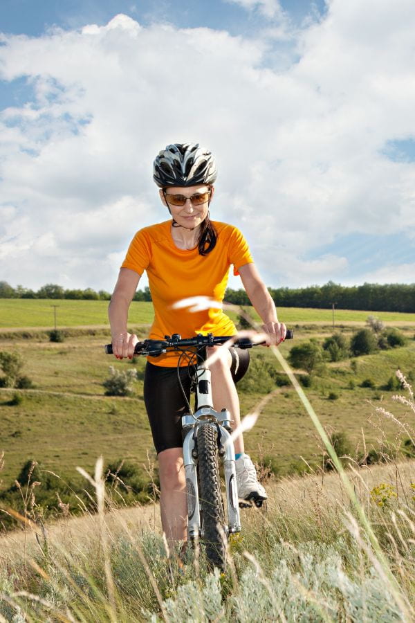 image of a woman riding a mountain bike outdoors